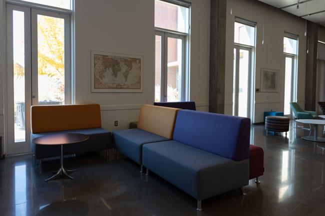 purple and orange couches with a world map